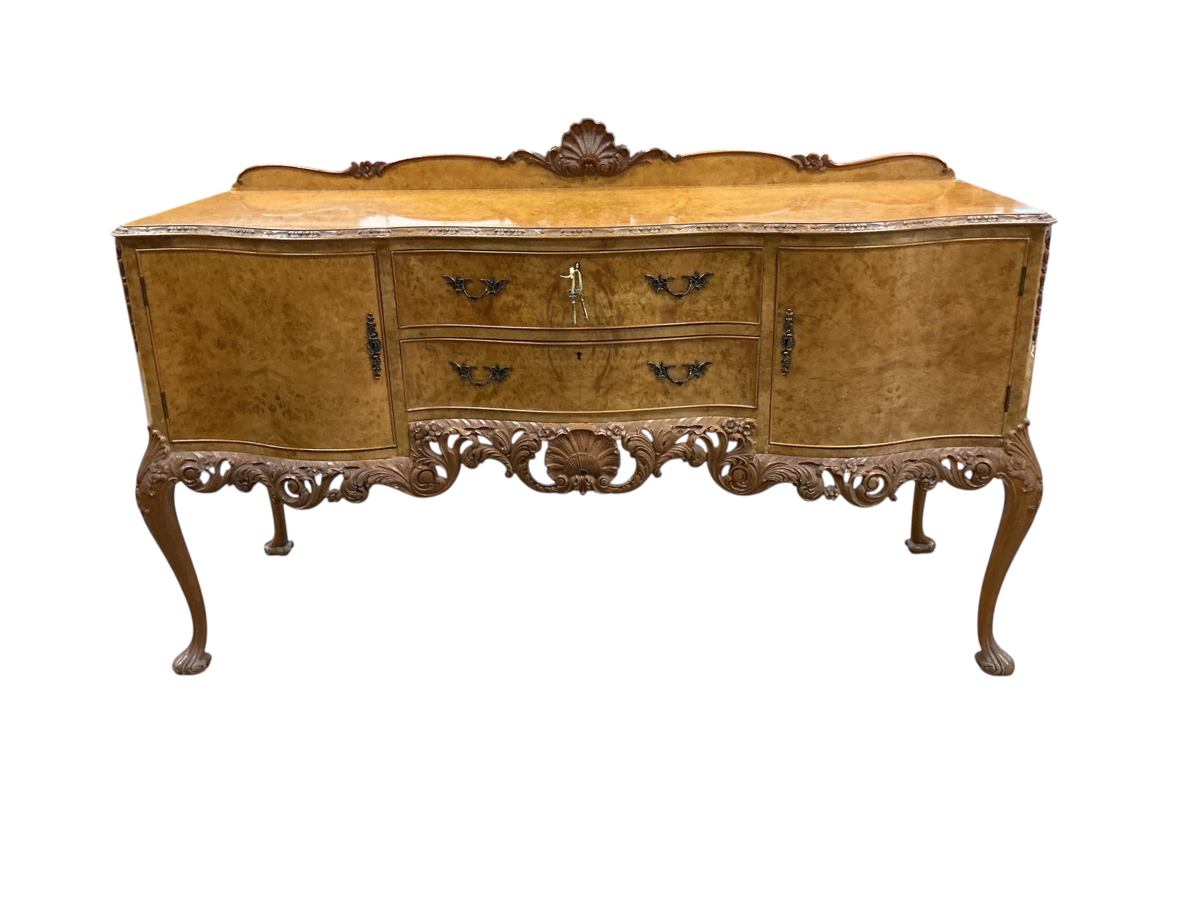 A Queen Anne Revival walnut serpentine sideboard, width 168cm, depth 60cm, height 91cm